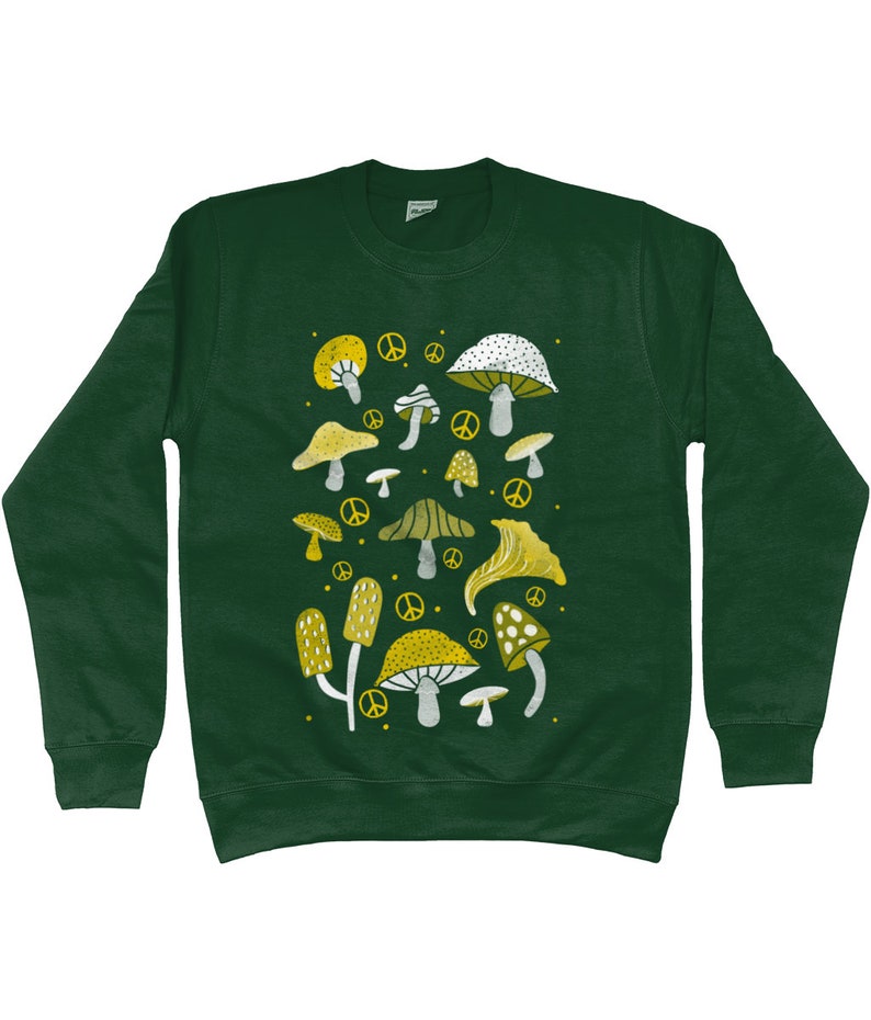 Puede incluir: Una sudadera verde oscuro con un dise&ntilde;o de setas blancas y amarillas. Las setas son de varias formas y tama&ntilde;os, y algunas tienen s&iacute;mbolos de paz junto a ellas.
