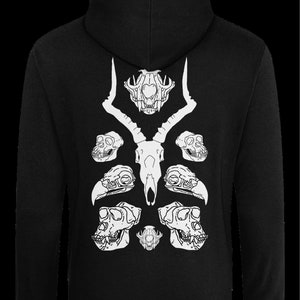 May include: Black zip-up hoodie with a white graphic print of animal skulls. The graphic features a deer skull with antlers, two monkey skulls, and two bird skulls.