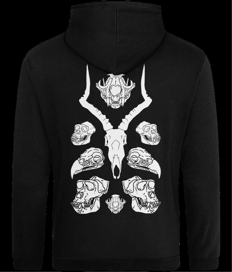 May include: Black zip-up hoodie with a white graphic print of animal skulls. The graphic features a deer skull with antlers, two monkey skulls, and two bird skulls.