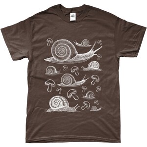 May include: A brown t-shirt with a white graphic print of snails and mushrooms.