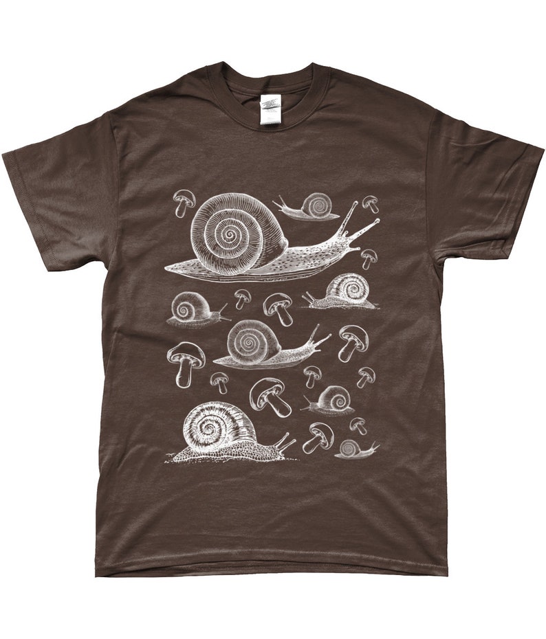 May include: A brown t-shirt with a white graphic print of snails and mushrooms.