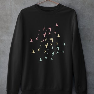 May include: Black sweatshirt with a flock of colourful birds printed on the front. The birds are in shades of pink, yellow, and blue.