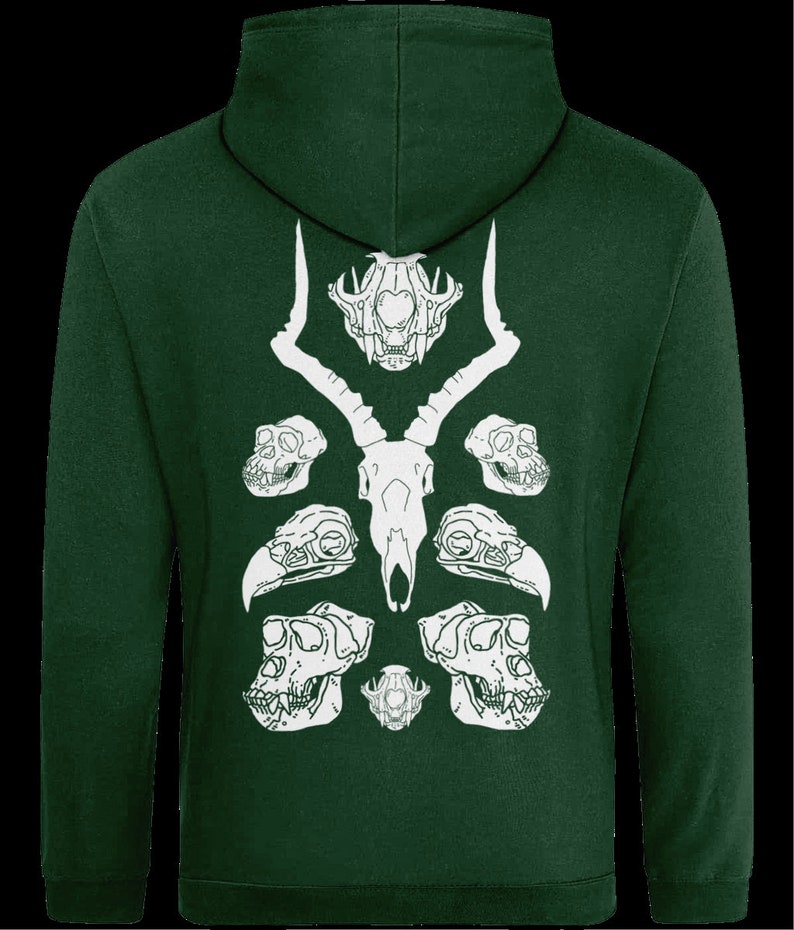 May include: A dark green hooded sweatshirt with a white graphic print of animal skulls. The graphic features a deer skull with antlers, two monkey skulls, and two bird skulls.