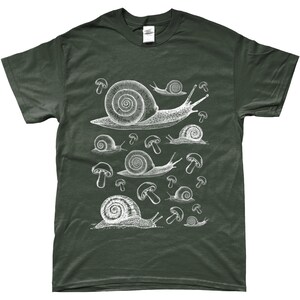 May include: A dark green t-shirt with a white graphic print of snails and mushrooms. The snails are drawn in a vintage style and are crawling on top of the mushrooms.