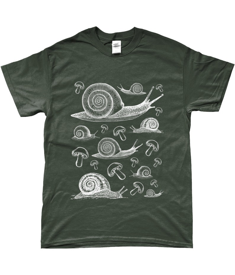 May include: A dark green t-shirt with a white graphic print of snails and mushrooms. The snails are drawn in a vintage style and are crawling on top of the mushrooms.