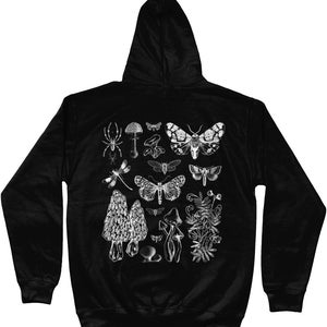 May include: Black hooded sweatshirt with a white print of various insects, mushrooms, and plants. The print includes a spider, dragonfly, moths, butterflies, and mushrooms.