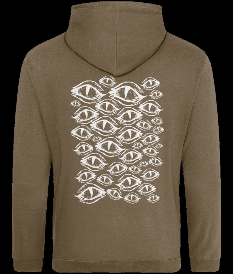 May include: A brown hooded sweatshirt with a white graphic print of multiple stylized eyes on the back.