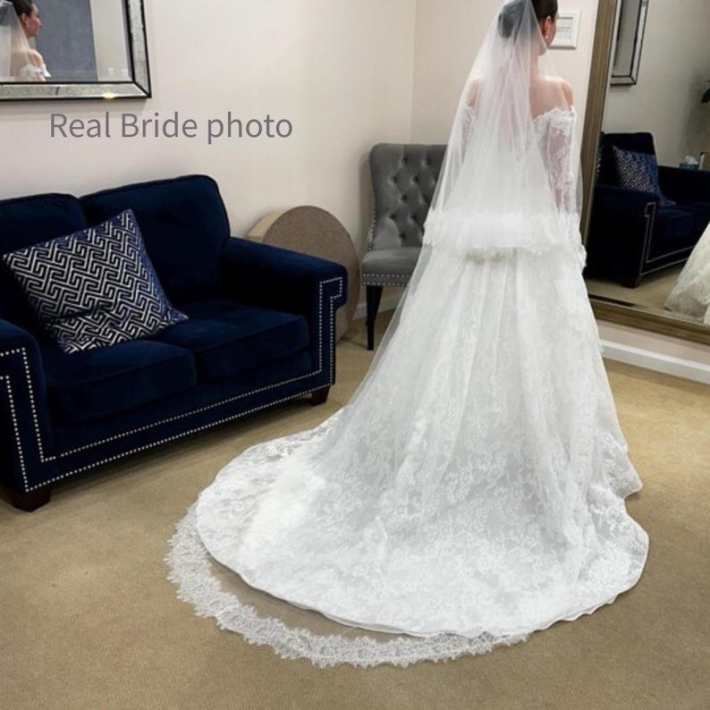 Real bride wearing chapel length wedding veil with blusher in light ivory, Chantilly lace trim