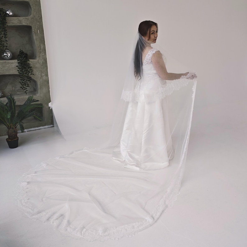Two-tier wedding veil showing 80 cm blusher and long cathedral layer in light ivory tulle