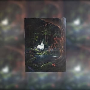 May include: A painting of a white unicorn standing in a dark forest with a stream of water in the foreground. The unicorn is facing to the right and has a long, flowing mane and tail. The forest is dense and dark, with tall trees and lush foliage. The stream is clear and sparkling, and the water is flowing gently.