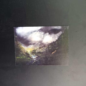 May include: A painting of a forest scene with a small stream running through it. The sky is cloudy and the trees are dark green.