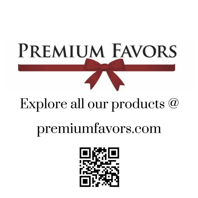 May include: A red ribbon with a bow tied in the center. The text "PREMIUM FAVORS" is above the ribbon. Below the ribbon, the text "Explore all our products @ premiumfavors.com" is displayed. A black and white QR code is below the text.
