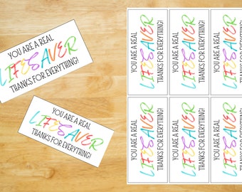 May include: Eight printable gift tags with the text "You are a real Lifesaver Thanks for everything!" in rainbow colors.