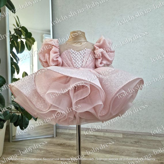 A Lush Sparkling Children's Dress with Luxurious Puffed Sleeves and Pearl Bead Embroidery. Royal Dress in Blush Color for 1st Birthday
