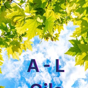May include: A-L Oils text in bold blue letters against a bright blue sky with white clouds. Green leaves frame the top and bottom of the image.