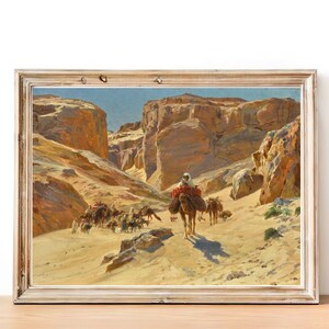 May include: A painting depicting a caravan of camels traveling through a desert canyon. The camels are laden with goods and the people riding them are dressed in traditional clothing. The painting is done in a realistic style and captures the beauty of the desert landscape.