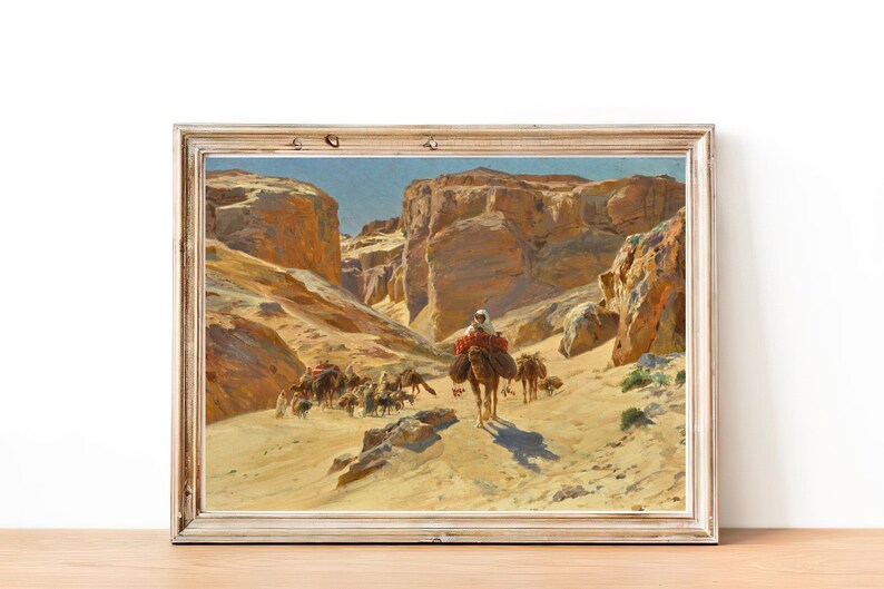 May include: A painting depicting a caravan of camels traveling through a desert canyon. The camels are laden with goods and the people riding them are dressed in traditional clothing. The painting is done in a realistic style and captures the beauty of the desert landscape.
