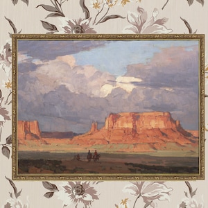 May include: A framed painting depicting a desert landscape with a large red rock formation in the background. The sky is cloudy and the sun is setting. There are three figures on horseback in the foreground.
