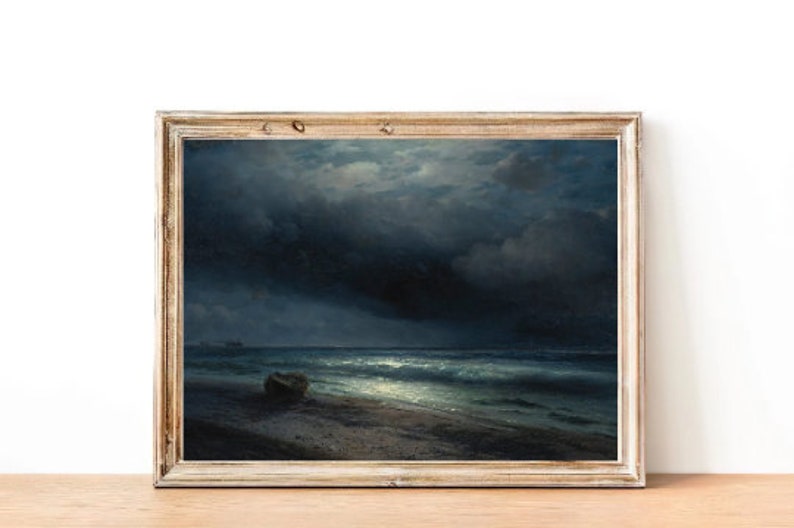 May include: A framed painting depicting a seascape at night. The painting shows a dark, stormy sky with a sliver of moon shining through the clouds. The sea is choppy and the waves are crashing on the shore. A small boat is visible in the distance.