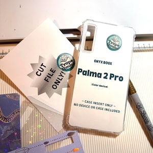 May include: A clear phone case with the text "ONYX BOOX Palma 2 Pro" and a "Trope Hound" logo. A white card with "CUT FILE ONLY!" and a "Trope Hound" logo is next to the case. A Sharpie marker is also visible.