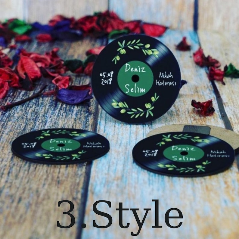 May include: Three black vinyl record coasters with green olive branch designs and white text. The text reads "Deniz Selim" and "Nikah Hatirasi" with the date "05.08.2018".