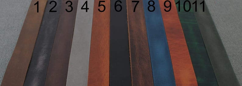 May include: Eleven vertical leather strips arranged side-by-side, numbered 1 through 11. The colours include various shades of brown, grey, black, blue, orange, and green. Each strip has a smooth, flat surface and a consistent rectangular shape.