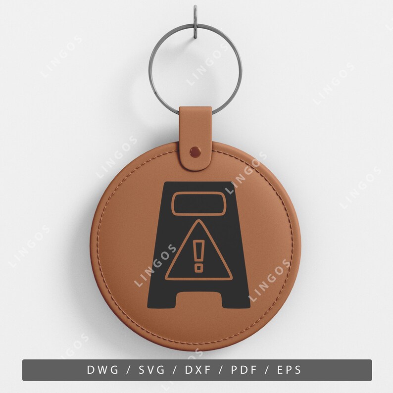 May include: A brown leather keychain with a black warning sign that says "Caution Wet Floor". The sign is in the shape of a yellow triangle with an exclamation point inside.
