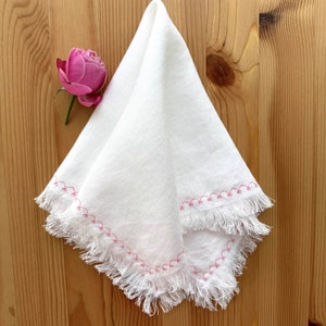 Fringed linen Napkins with embroidery.