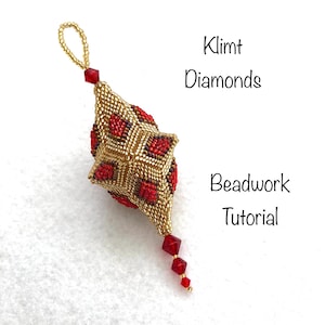 May include: A gold beaded ornament with red accents and a loop for hanging. The ornament is in a star shape with a beaded tassel. Text on the image reads "Klimt Diamonds Beadwork Tutorial."