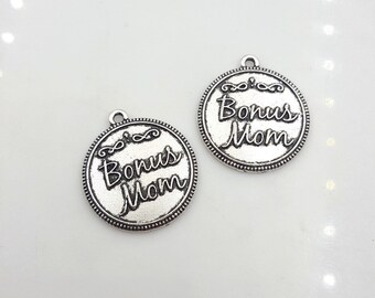 May include: Two silver-toned metal charms with the words "Bonus Mom" in a cursive font.