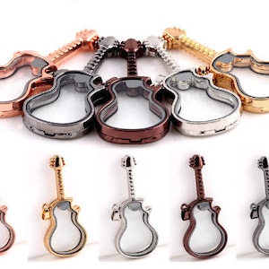 May include: Six guitar-shaped locket charms in different finishes: rose gold, silver, black, bronze, gold, and silver. Each charm has a clear glass insert.