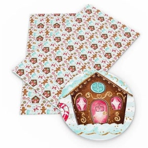 May include: A sheet of white faux leather with a gingerbread house and Christmas-themed pattern. The pattern includes gingerbread men, candy canes, and ornaments. The sheet is perfect for crafting projects.