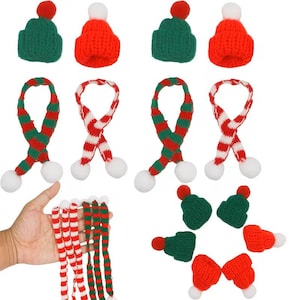 May include: A collection of miniature Christmas-themed knitted hats and scarves. The hats are green or red with a red or white pom-pom. The scarves are red and white striped or green and red striped, with white pom-poms at the ends.