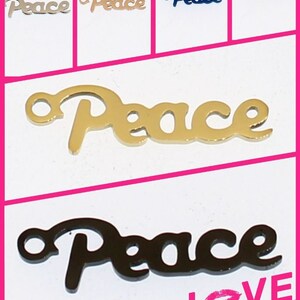 May include: Five different colored metal charms with the word "Peace" in a cursive font. The charms are shown on a white background. The charms are gold, silver, blue, green, and black.