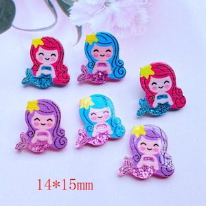 May include: Six colorful mermaid-themed resin embellishments with glitter details. Each mermaid is approximately 1.4 inches by 1.5 inches.