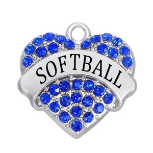 May include: Silver heart charm with blue rhinestones and the word "SOFTBALL" on a banner.