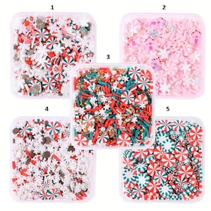 May include: Five clear plastic containers filled with colorful Christmas-themed sprinkles. The sprinkles include red and white peppermint candies, snowflakes, and other festive shapes. Ideal for decorating baked goods.