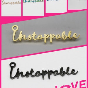 May include: Five different color variations of the word "Unstoppable" in a cursive font. The word is shown in gold, silver, black, blue, and rainbow colors. The word is also shown in a larger size in gold and black.