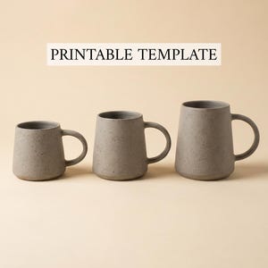 May include: Three gray ceramic mugs of varying sizes with a speckled texture. Each mug has a rounded body and a curved handle. The text "PRINTABLE TEMPLATE" is displayed above the mugs.