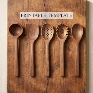 May include: Five wooden kitchen utensils, including a spoon, spatula, slotted spoon, pasta server, and another spoon, are arranged on a rustic wooden cutting board. The text "PRINTABLE TEMPLATE" is displayed on the board. The utensils are made of a dark wood.