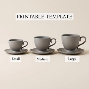 May include: A printable template featuring three gray cups and saucers in small, medium, and large sizes. Each cup has a curved handle and a pedestal base, arranged in a row with labels indicating their respective sizes below each set.