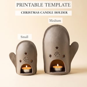 May include: Two grey mitten-shaped candle holders in small and medium sizes, each featuring cutouts of stars and a snowflake. A lit tea light candle sits inside the arched opening of each holder. Text reads: PRINTABLE TEMPLATE CHRISTMAS CANDLE HOLDER.