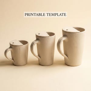 May include: Three beige ceramic mugs of varying sizes, each with a matching lid that partially covers the opening. The mugs have curved handles and a minimalist design. The text "PRINTABLE TEMPLATE" is above the mugs.