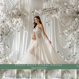 Puede incluir: Un telón de fondo floral blanco con una mujer embarazada con un vestido blanco de encaje. El telón de fondo está hecho de tela blanca y presenta flores blancas. La mujer está de pie frente al telón de fondo y se está sosteniendo la barriga. El texto "SPRING WHITE FLORAL DIGITAL BACKDROP" está en la parte inferior de la imagen.