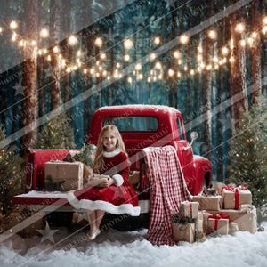 May include: A young girl in a red dress with white trim sits in the back of a vintage red truck filled with wrapped gifts. The scene is set in a snowy forest with string lights and Christmas trees, creating a festive holiday atmosphere.