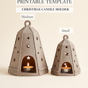 May include: Two bell-shaped, light gray candle holders with star and circle cutouts, labeled as Medium and Small. The text PRINTABLE TEMPLATE CHRISTMAS CANDLE HOLDER appears above. Each holder contains a lit tea light candle inside the base.
