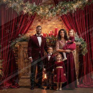 May include: A family of five poses in front of a fireplace decorated for Christmas. The adults wear burgundy velvet suits and dresses, while the children wear matching burgundy outfits. The background includes a brick fireplace, red curtains, and Christmas trees.