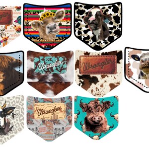 May include: Nine different cow-themed pocket designs featuring a variety of patterns and colors. Each design includes a "Wrangler" logo. The designs include a cow with a sunflower crown, a cow with sunglasses, a cow with a camouflage pattern, a cow with a leopard print, a cow with a cowhide pattern, a cow with a turquoise background, and a cow with a vintage western design.
