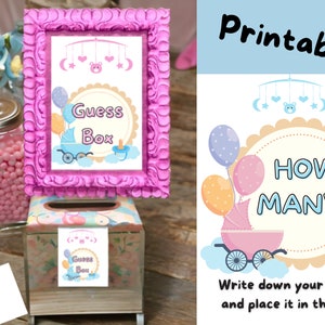 May include: Printable baby shower game with a pink and blue theme. The game asks guests to guess how many items are in a box. The game includes a pink and blue sign with the text "Guess Box" and a pink and blue sign with the text "How Many?"