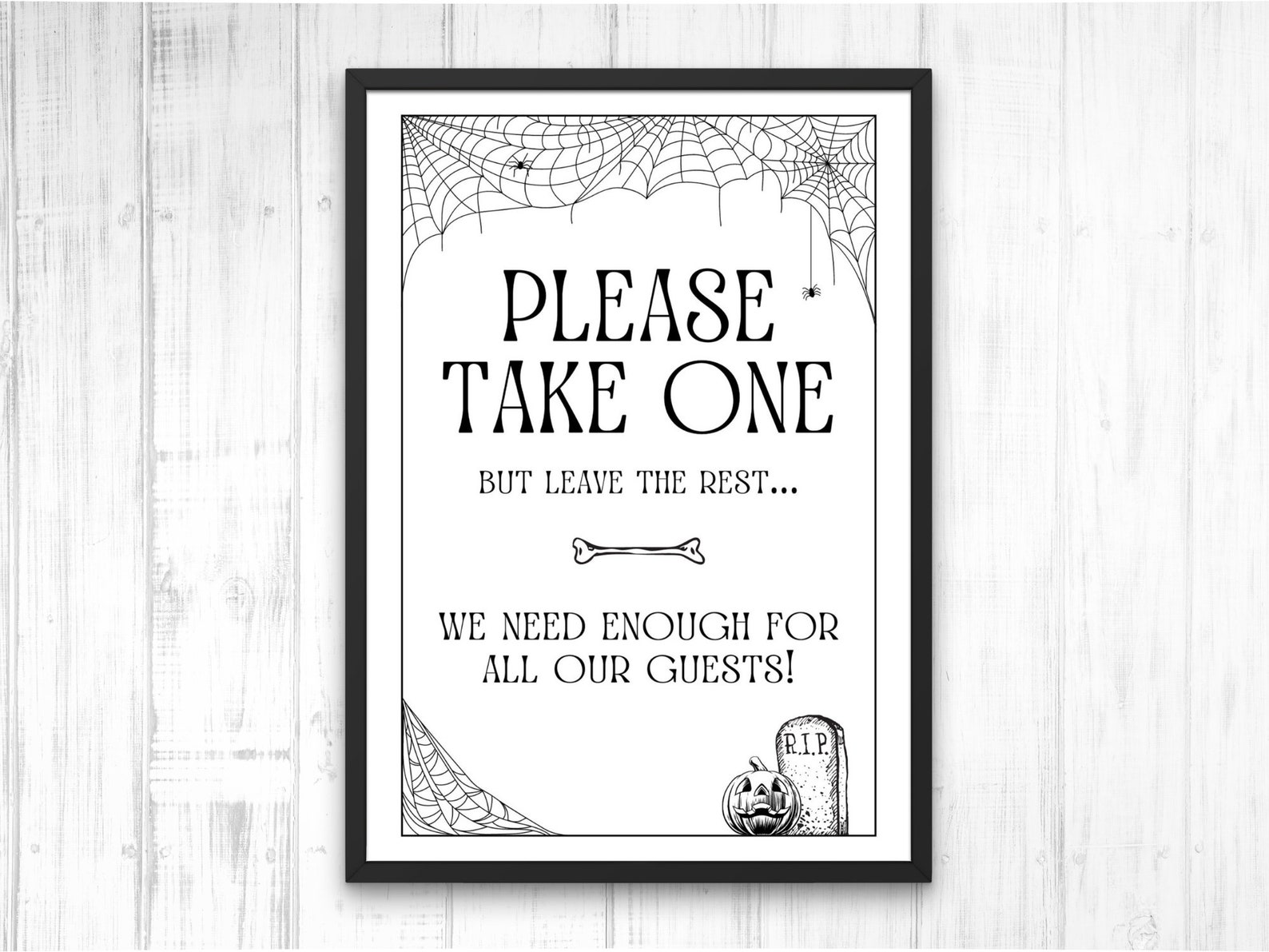 A Monochrome Web Border Black-and-white please-take-one Halloween sign with a fine web border.